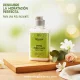 Crema Humectante Naturesse 300 ml con dispensador sobre fondo natural.