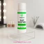 Botella de Slip Solution Cherimoya de 110 ml sobre una base transparente, acompañada de herramientas de manicura.